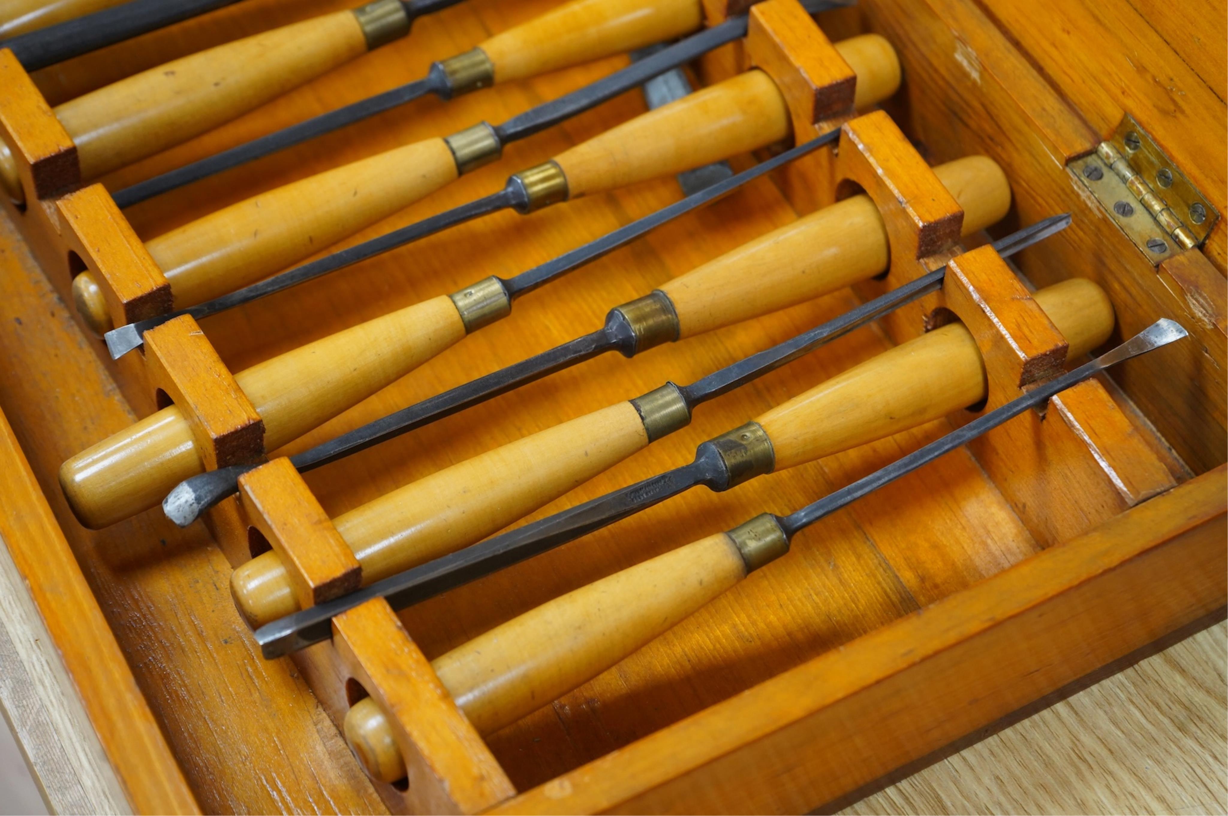 An 18-piece Marples wood carving chisel set, contained within the original fitted pine case with original Marples label to the inside of the lid